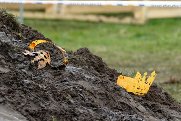 Construction site in Nederland showing excavated soil with a portion of yellow safety equipment...