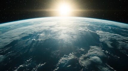 Earth sunrise from space, showing clouds and atmosphere.