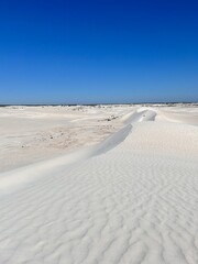 Lancelin, a coastal town in Western Australia, is famous for its white sand dunes, perfect for sandboarding, off-road adventures, pristine beaches, windsurfing, and a relaxed atmosphere.
