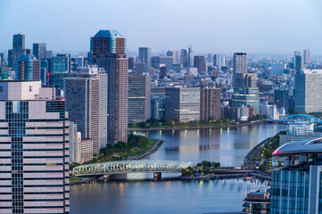 Naklejka premium Cityscapes of tokyo sun rise winter, Skyline of Tokyo, office building and downtown of tokyo in minato, Japan, Tokyo is the world's most populars metropolis and centers for world business.