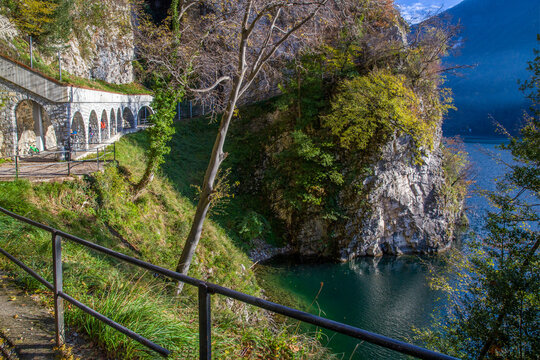 Amazing view on   Olive trail (so-named) , lake Lugano and Swiss Alps  in suburb of Lugano city. Amazing autumn leaf color. Part pf trai under stone canopy