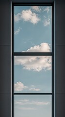 Modern window view showcasing clouds and a bright blue sky in urban setting.