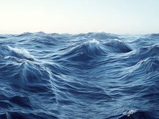 A serene view of rolling ocean waves under a clear sky.
