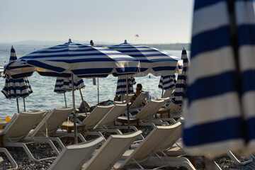 Loungers and umbrellas on the seaside beach in Provance, France. 
