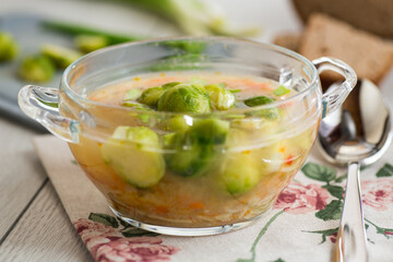 Vegetable Soup with Brussels Sprouts in a Glass Plate