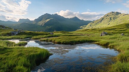 Fototapeta premium Mountain landscape with a still pond reflecting the sky at dusk a beautiful scene