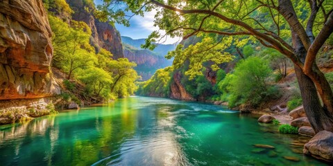 Obraz premium Serene River Gorge Lush greenery, sunlit waters, and towering canyon walls create a breathtaking natural landscape