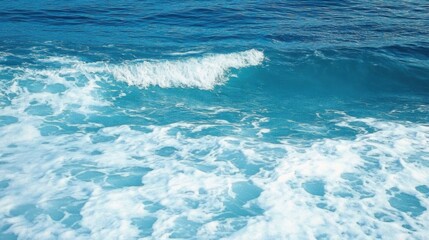 Fototapeta premium Pure blue turquoise water texture of the ocean sea with foam from and waves