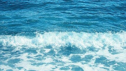 Fototapeta premium Pure blue turquoise water texture of the ocean sea with foam from and waves
