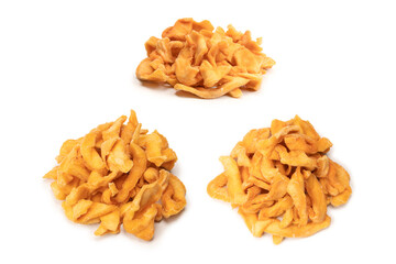 Dried melon slices isolated on a white background.