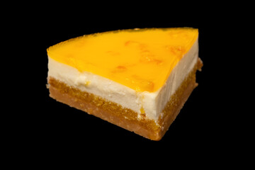 Orange cheesecake isolated on a white background.