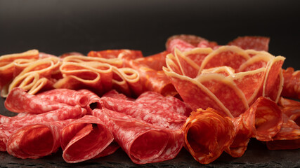 Different kinds of meat cuts on a board.