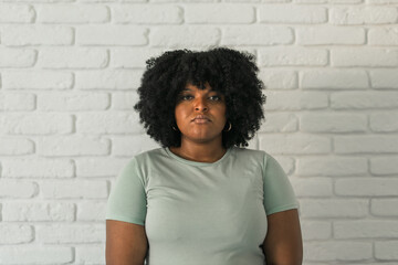 Portrait of young african american woman with frowning expression