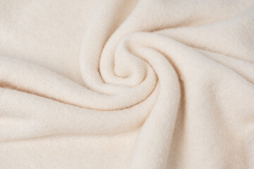 Beige sweater texture as a background.