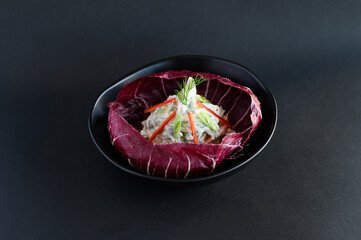 Fresh salad served in crisp cabbage leaves, a light and healthy dish perfect for an Asian menu.
