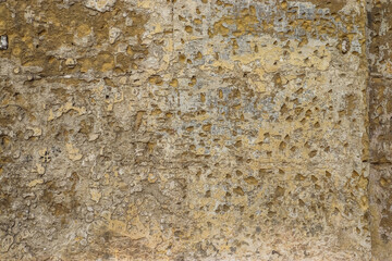 A detailed view of a centuries old stone wall in Malta's historic neighborhoods.