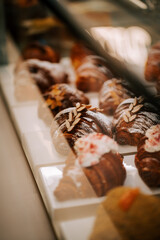 Freshly baked croissants displayed on the counter in a charming coffee shop during morning hours