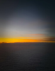 Sunset or sunrise over clouds.