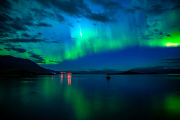 Northern lights dancing over lake Torne trask . Abisko national park in north of Sweden.