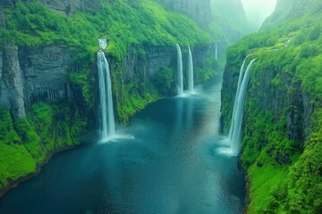 Majestic waterfalls cascading down lush green cliffs in a serene mountain valley