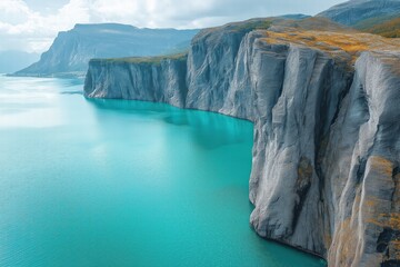 Majestic cliffs overlooking turquoise waters in a serene landscape by the coastline