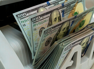 Cash being processed in a currency counting machine
