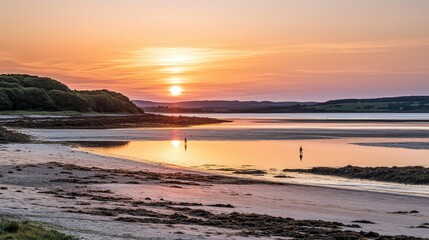 Fototapeta premium Sunset Beach Scene With Solitary Figures At Low Tide