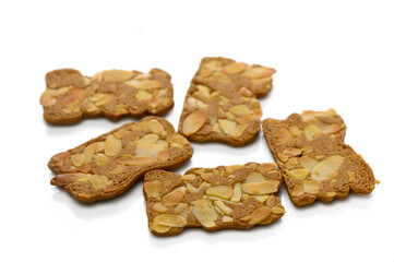 Deliciously crunchy gingerbread cookies topped with sliced almonds for a sweet treat