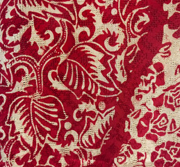 Close up of random flower and leaves illustration pattern drawn in red color, with beige...