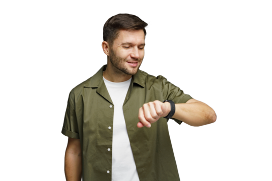Man checking watch with a slight smile while dressed in a casual green shirt and white t-shirt