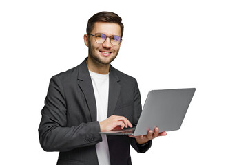Young professional smiles while using laptop, showcasing modern technology in a minimalist setting