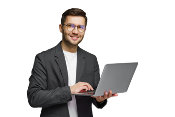 Young professional smiles while using laptop, showcasing modern technology in a minimalist setting