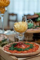 Wedding table with snacks, ham, crayfish and salads