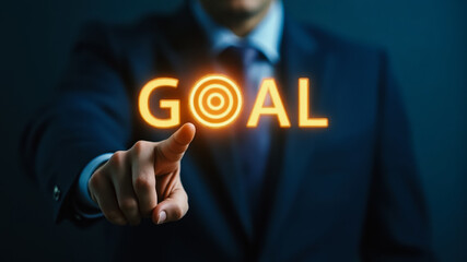 Businessman's Hand Pointing to Illuminated Goal with Target Symbol