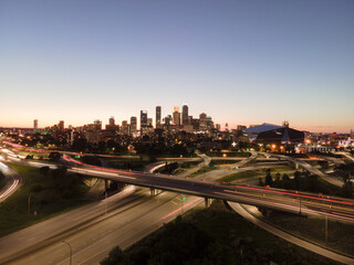 Fototapeta premium Minneapolis skyline at dusk with light trails