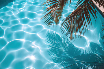 Aqua waves ripple across a textured pool surface, shadow of a coconut palm visible