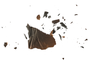 Burned and charred paper scraps isolated on white background, top view