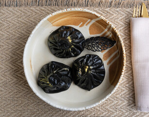 Black khinkali, Georgian seafood chinkali, spicy dumplings with minced meat also called dimsum