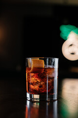 Negroni cocktail with orange zest at the bar