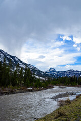Mountain river with muddy water, melting snow in the mountains. Mountain landscape - Montana