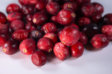 Close-up of freeze-dried cranberries, some whole and others halved, showcasing their vibrant red color and airy texture. Perfect for snacks, baking, or as a healthy topping.