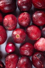 Close-up of freeze-dried cranberries, some whole and others halved, showcasing their vibrant red color and airy texture. Perfect for snacks, baking, or as a healthy topping.