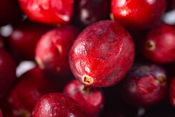 Close-up of freeze-dried cranberries, some whole and others halved, showcasing their vibrant red color and airy texture. Perfect for snacks, baking, or as a healthy topping.