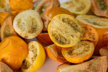 A vibrant collection of freeze-dried tomatoes in a mix of whole and sliced pieces. The rich textures and earthy tones highlight the preservation process.