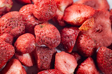 A detailed close-up of vibrant red freeze-dried strawberries, showcasing their texture and natural appeal. Perfect as a healthy snack or for culinary use.