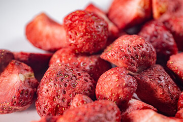 A detailed close-up of vibrant red freeze-dried strawberries, showcasing their texture and natural appeal. Perfect as a healthy snack or for culinary use.