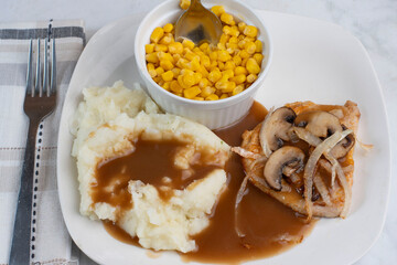 bneless pork chop  with mash potatoes and corn