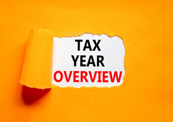 Tax year overview symbol. Concept words Tax year overview on beautiful white paper. Beautiful orange table orange background. Business tax year overview concept. Copy space.
