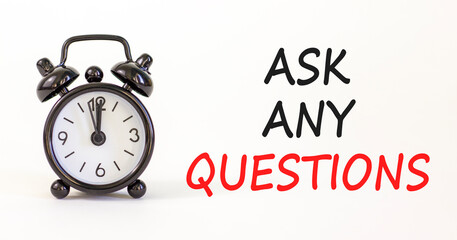 Ask any questions symbol. Concept words Ask any questions on beautiful white paper. Beautiful white background. Black alarm clock. Business ask any questions concept. Copy space.