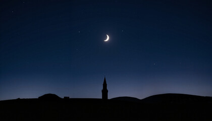 Fototapeta premium Crescent moon over silhouetted landscape at night, Ramadan